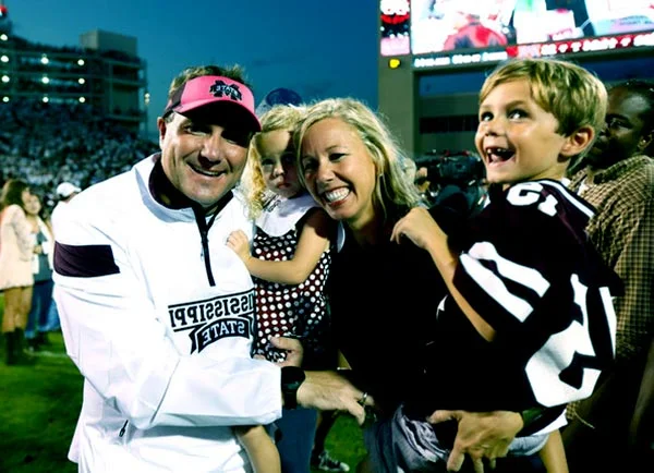Image of Megan with her husband and children